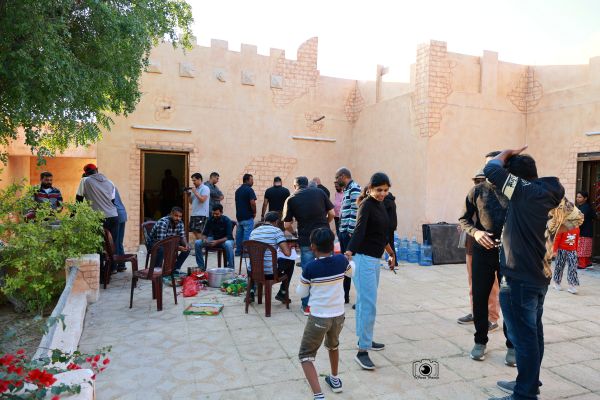 ANRIA Qatar families gathered outdoors at a winter get-together