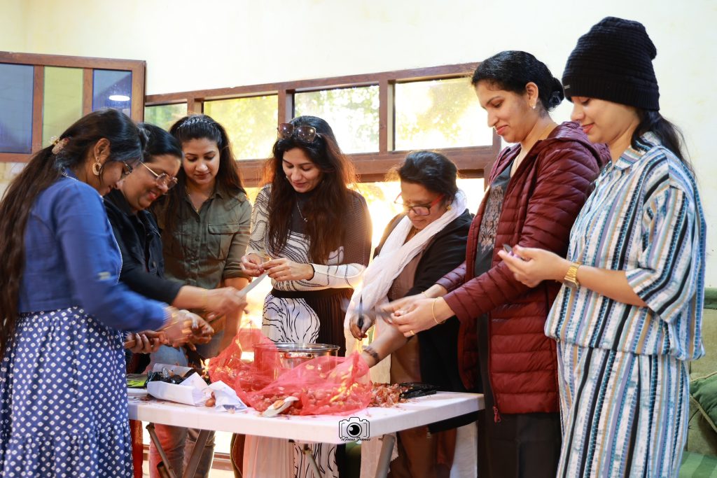 Members preparing and serving food together at an ANRIA Qatar gathering