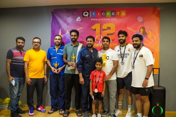 The ANRIA Qatar badminton squad together after a tournament