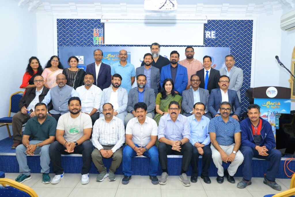 A large group photograph of ANRIA Qatar members at an association event