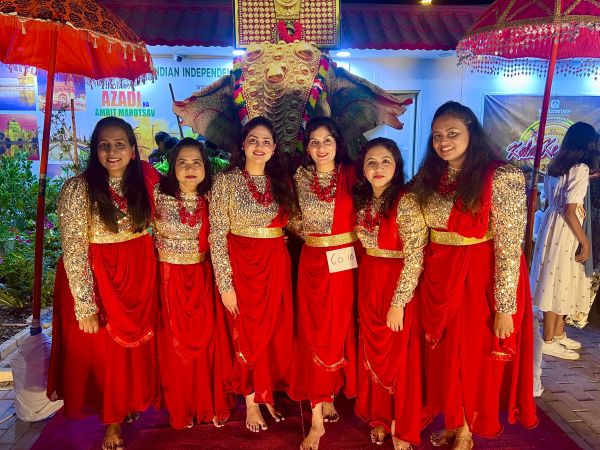 ANRIA Qatar dancers in red and gold costumes performing on stage