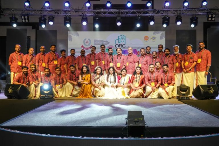 ANRIA Qatar members performing on stage in traditional Kerala dress at Onam
