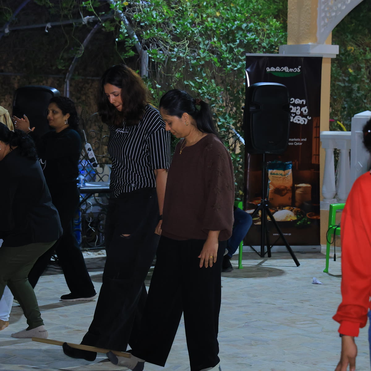 Members taking part in outdoor games at an evening family gathering